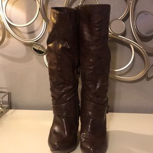 Brown heeled below the knee boots
